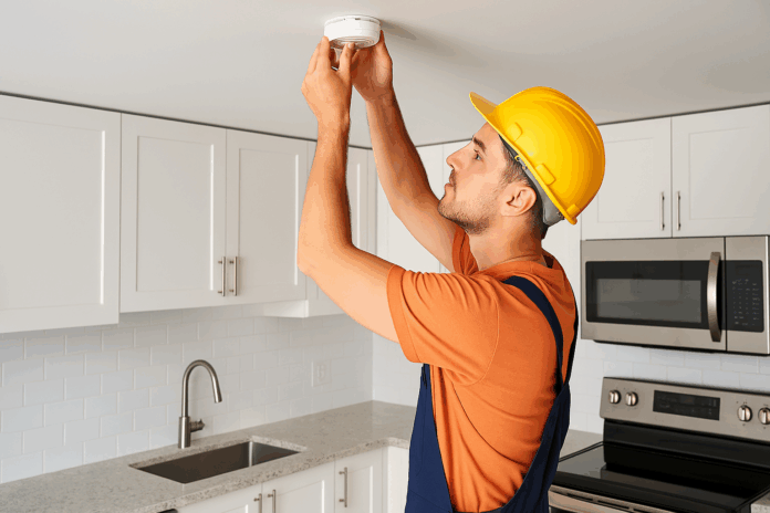 residential electrician burlington electrician installing residential smoke alarm